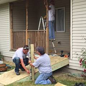 Martin Employees construct a handicap entrance for a community member during their Pay it Forward month